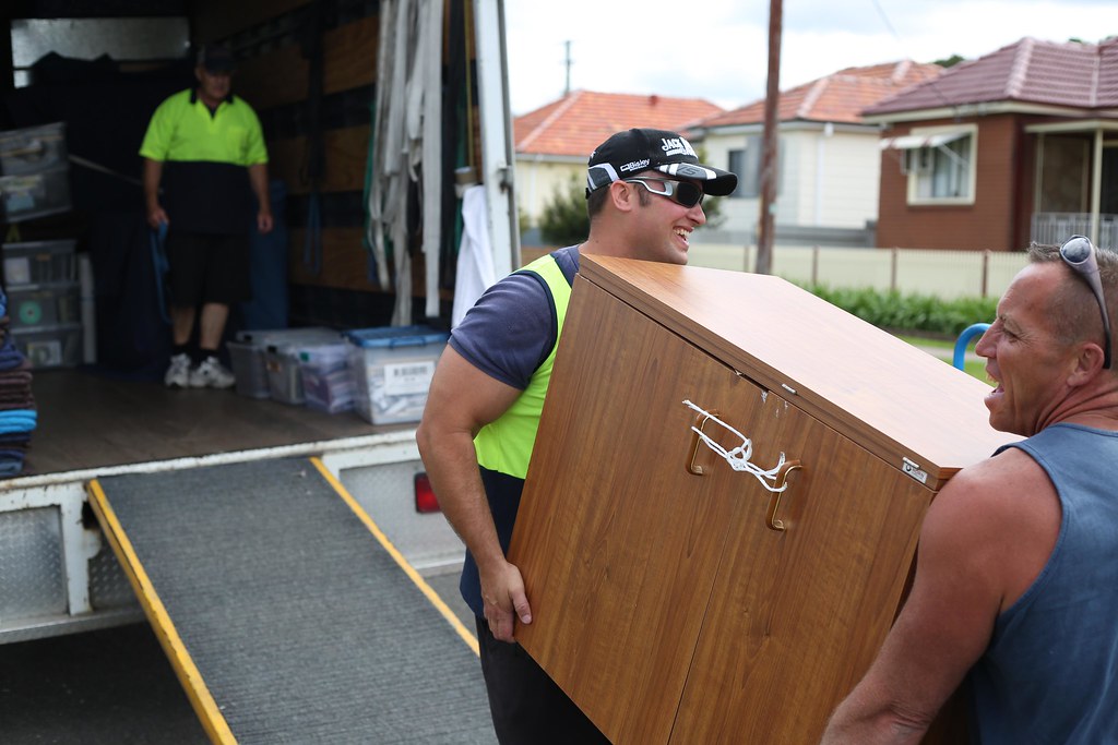 man carrying households